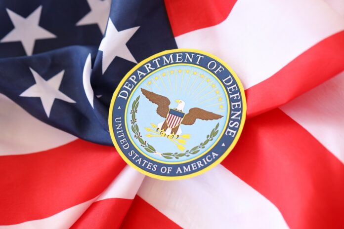 Department of Defense emblem on American flag