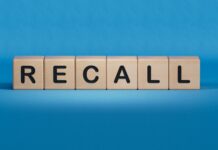 Eye Drops Recalled – Sight At Risk? Wooden blocks spelling recall on a blue background