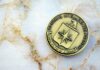 CIA emblem coin on marble surface